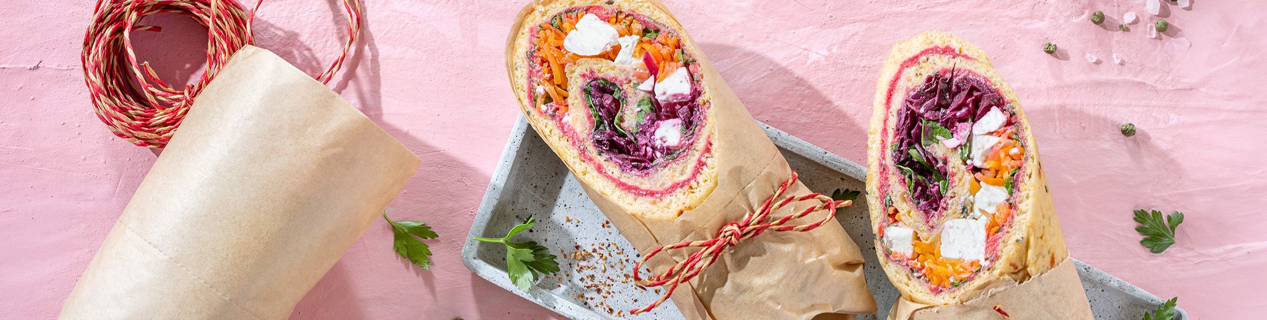Titelbild mit gefüllter Rolle auf rosa Untergrund